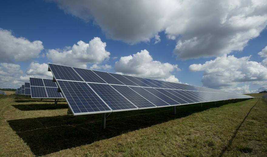 Solar panel array generating clean renewable electricity under clear sky
